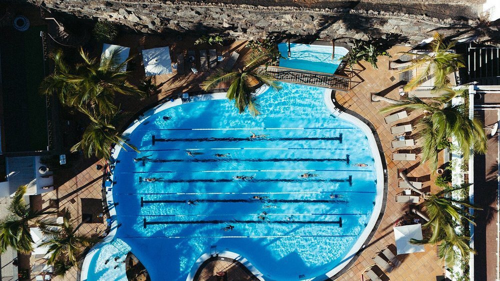 Aerial view of the outdoor swimming pool with lap lanes at luxury Hotel Fariones Lanzarote Puerto de