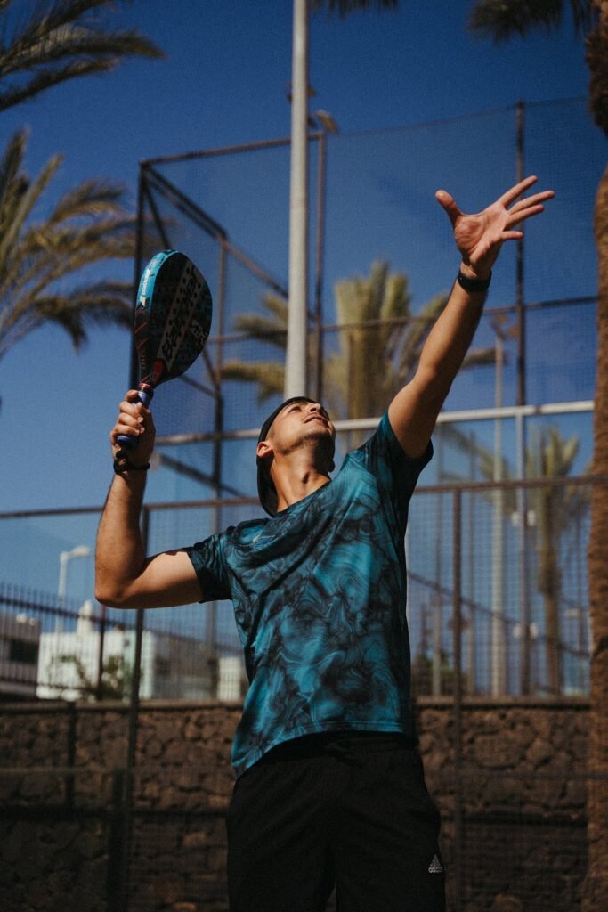 Player serving on padel court at luxury hotel Lanzarote, Hotel Fariones Puerto del Carmen