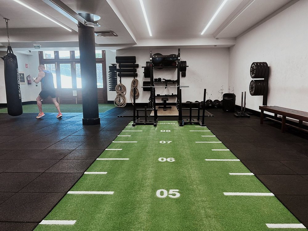 Modern fitness gym at luxury Hotel Fariones Lanzarote with punching bag, weights and turf track